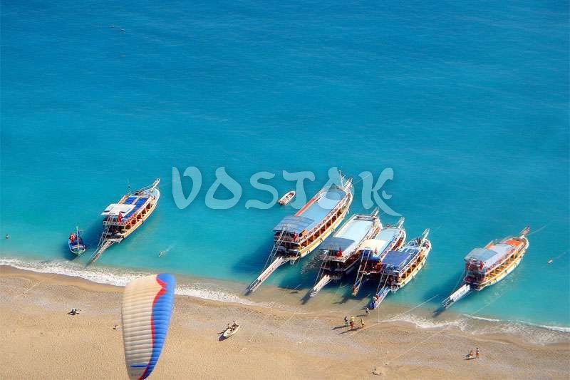 Aerial view of colorful boats in mediterranean sea in Oludeniz